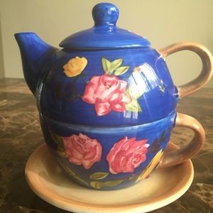Blue teapot with built in cup